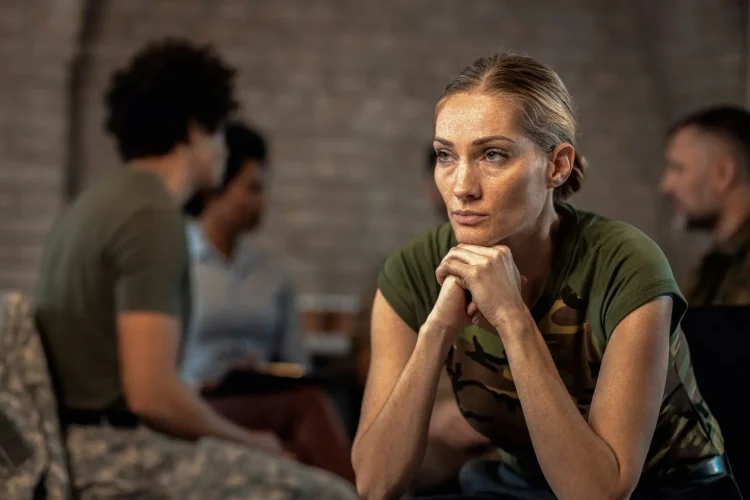 Portrait of female veteran in PTSD support group.